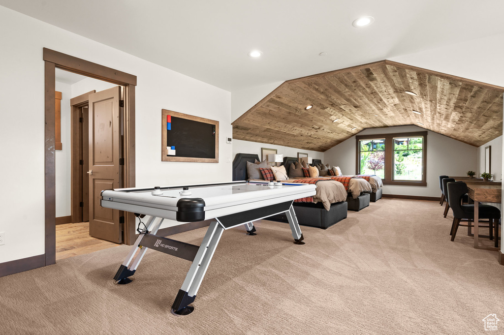 Playroom featuring vaulted ceiling and light colored carpet