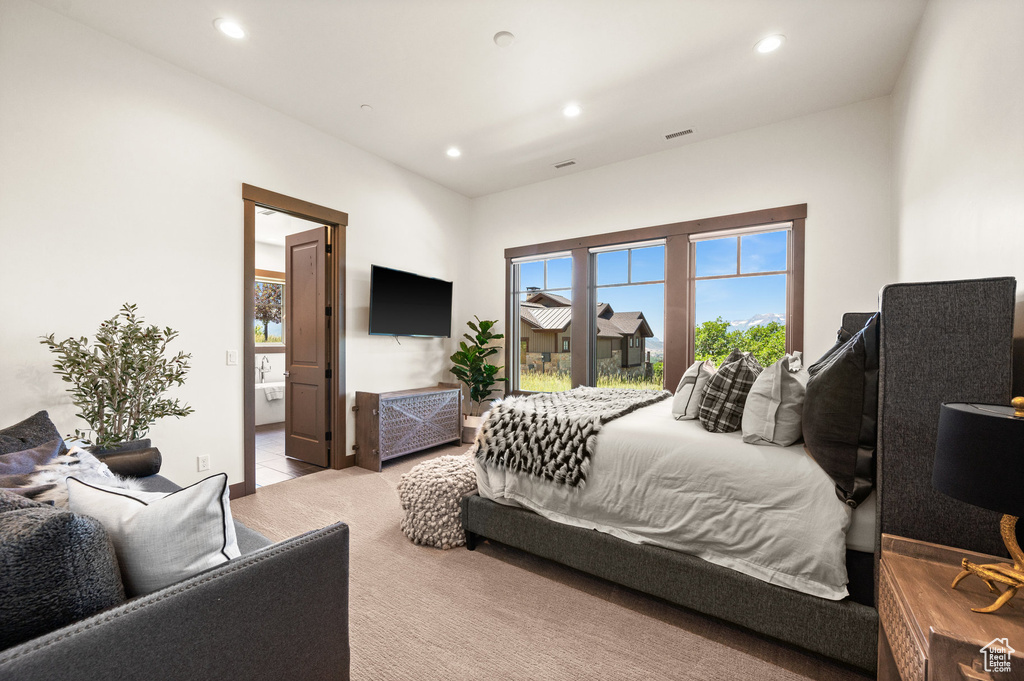 Bedroom with light carpet