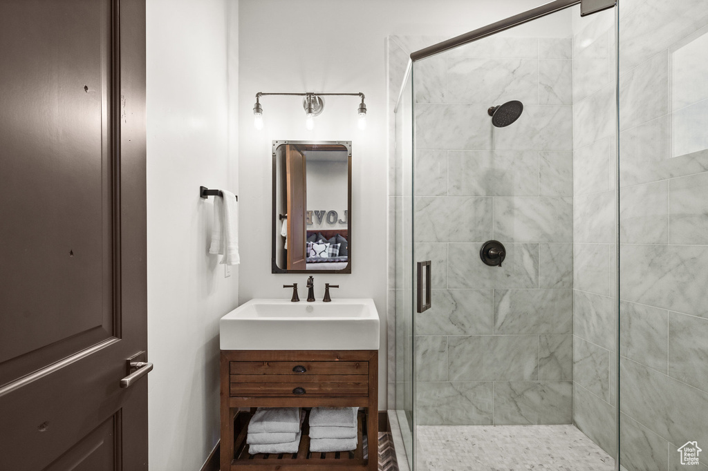 Bathroom with walk in shower and vanity