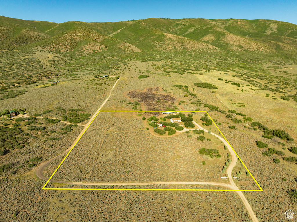 Birds eye view of property with a mountain view