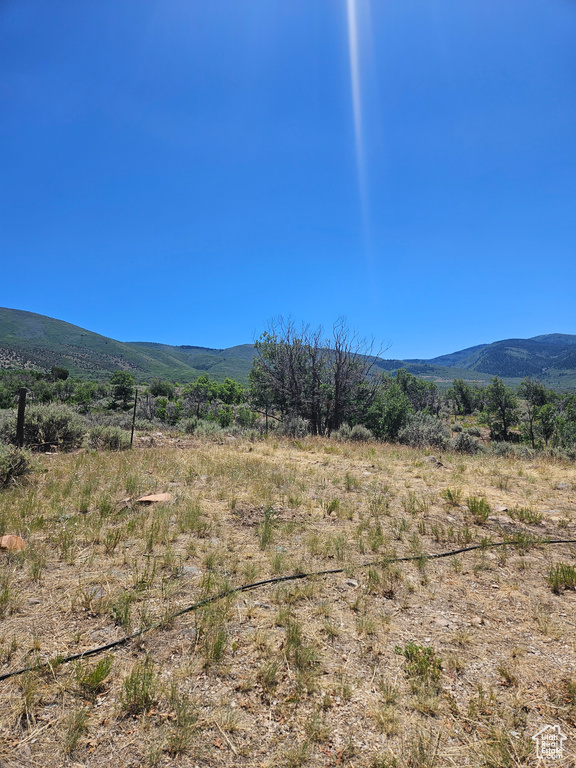 Property view of mountains featuring a rural view