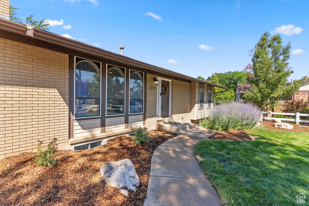 Property entrance with a lawn