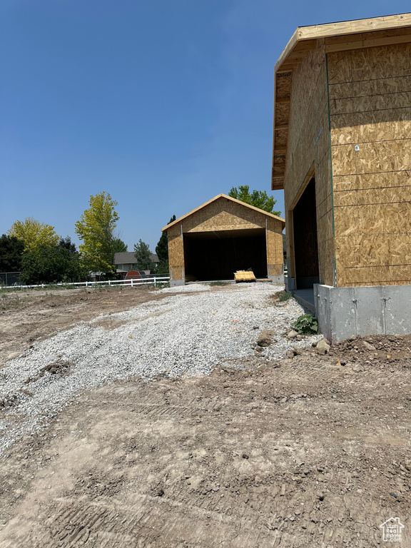 View of property exterior featuring an outdoor structure