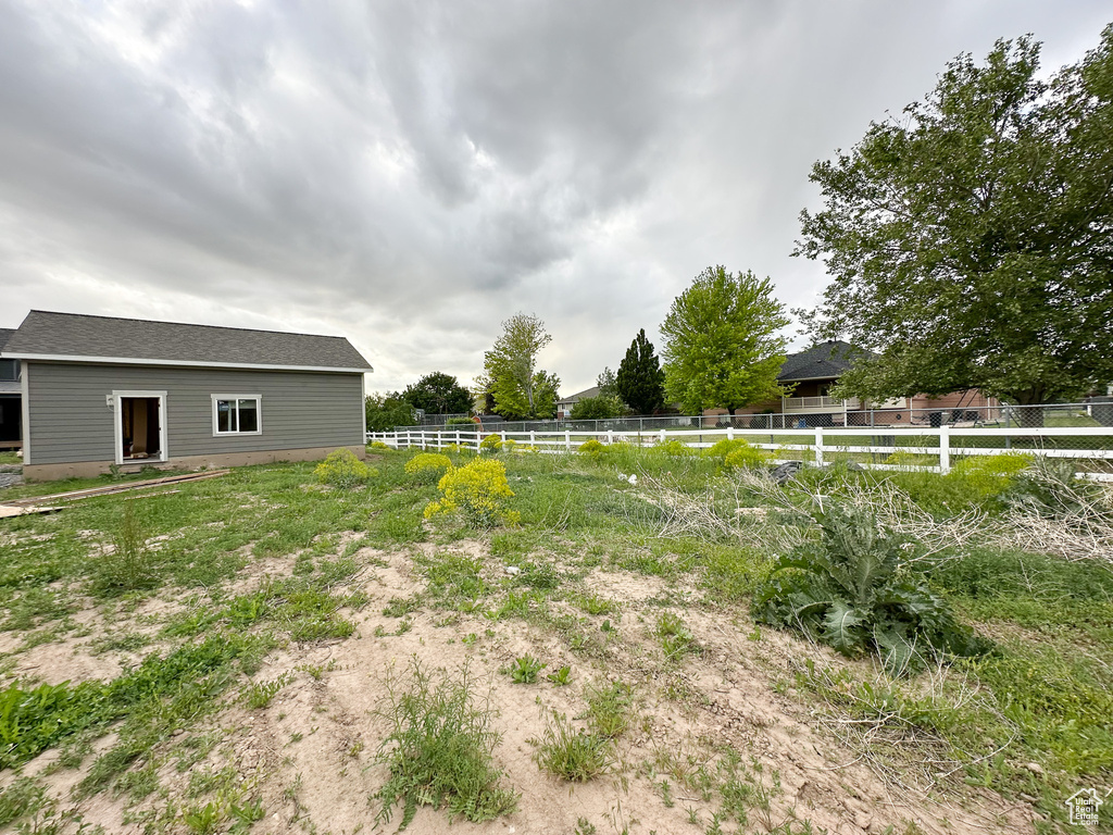 View of yard featuring fence