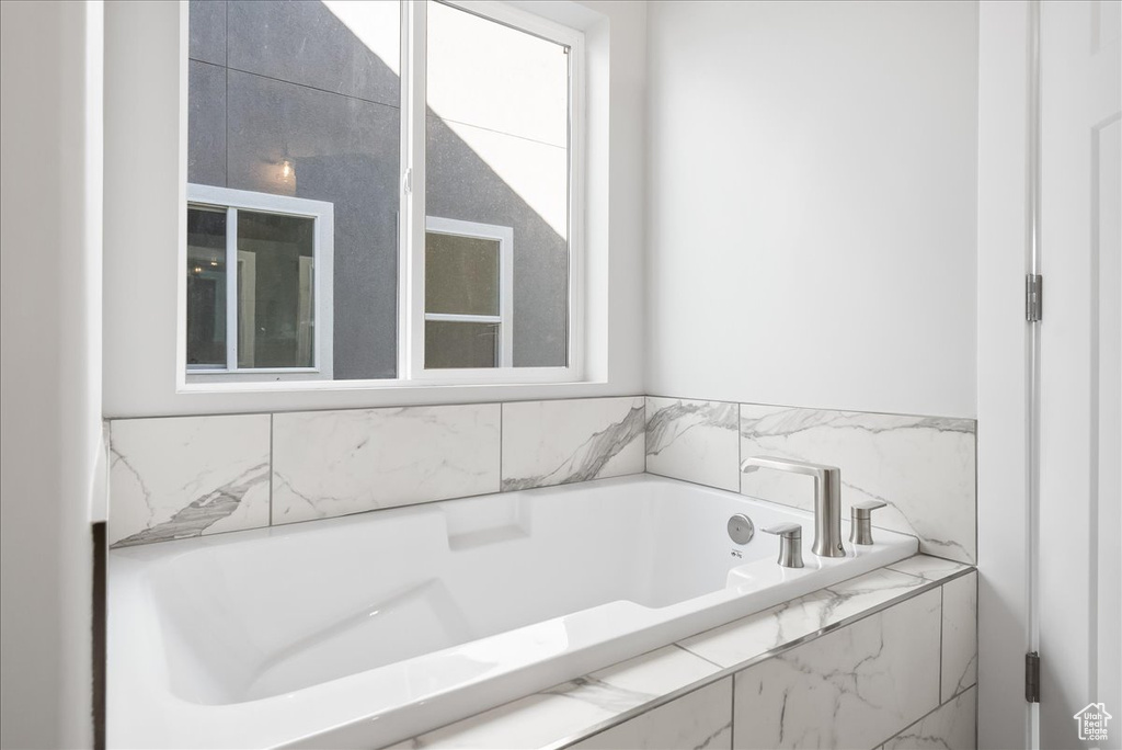 Bathroom with tiled tub