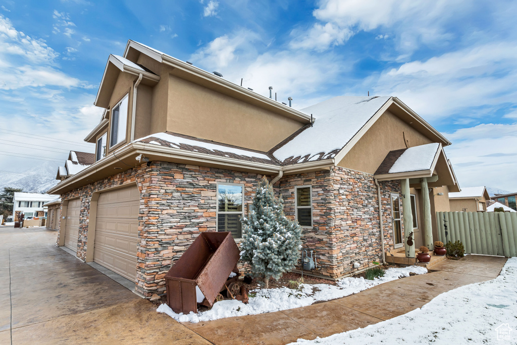 View of front of property featuring a garage