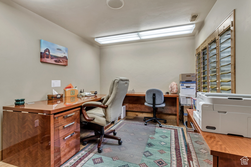 Office area with wood-type flooring