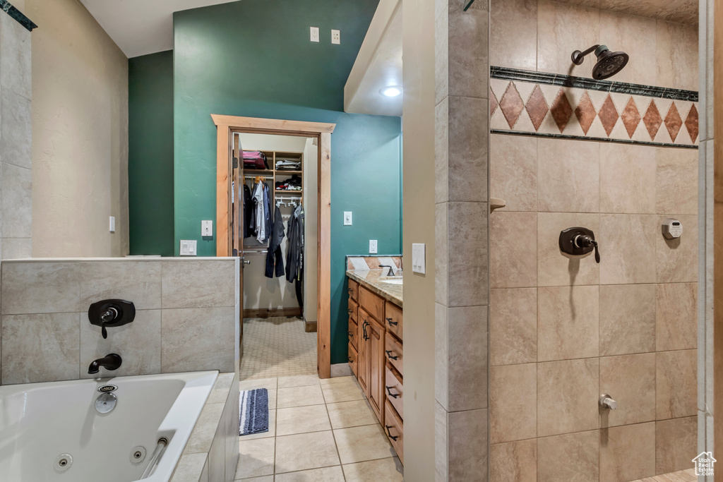 Bathroom featuring vanity and tile patterned flooring