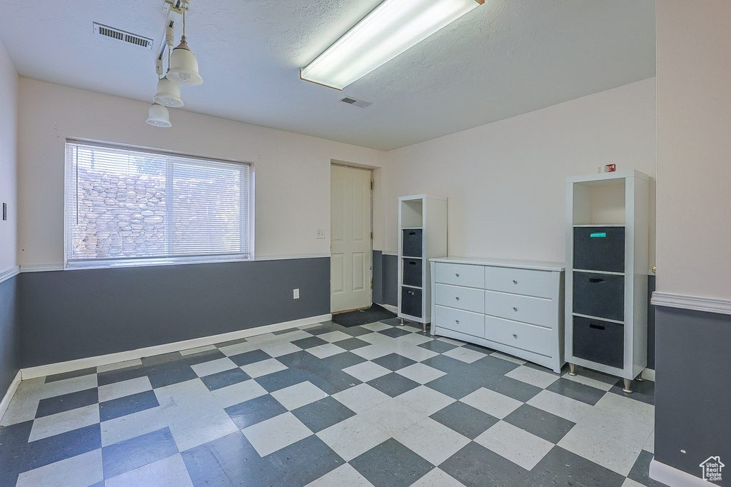 Empty room featuring tile patterned flooring