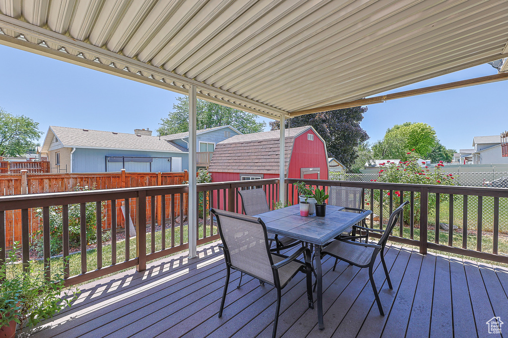 Deck featuring a storage shed