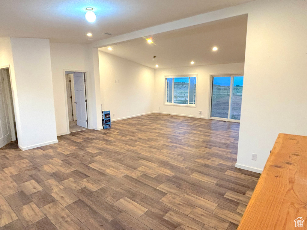 Unfurnished room with dark hardwood / wood-style floors