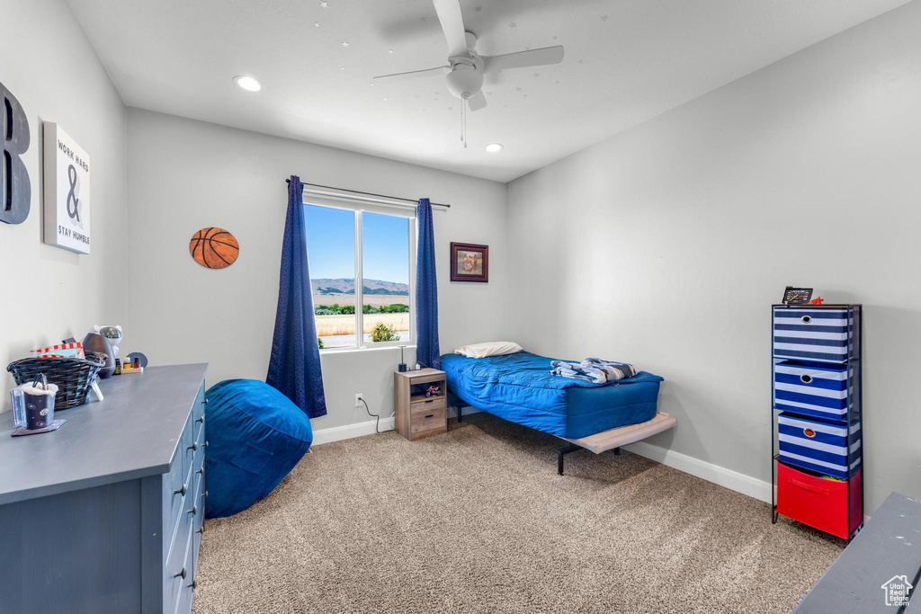 Bedroom with carpet flooring and ceiling fan