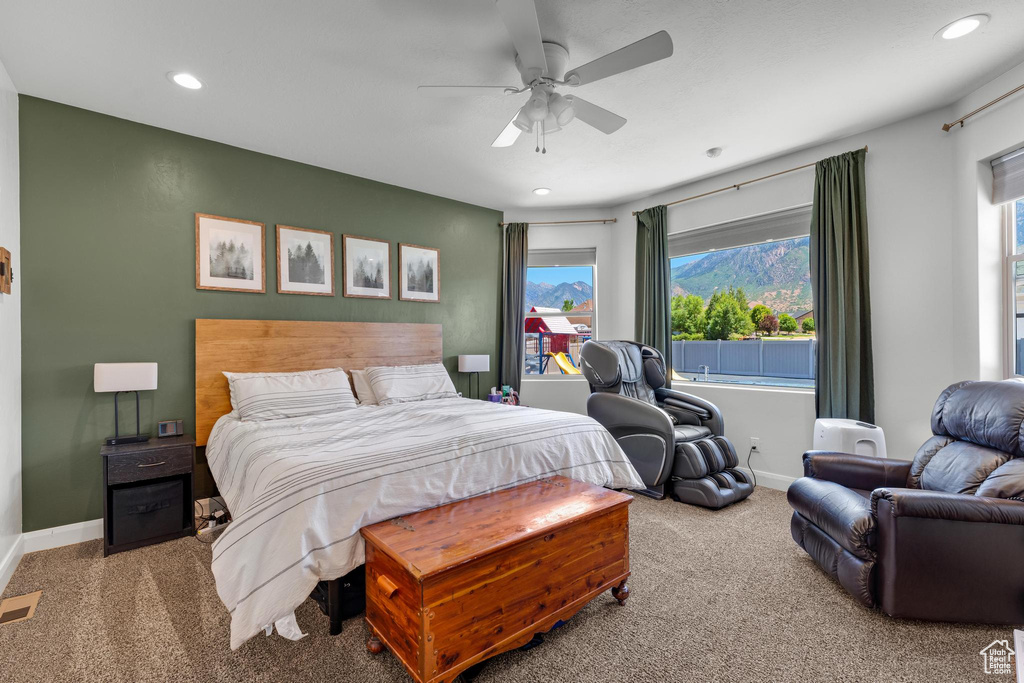 Bedroom featuring carpet floors and ceiling fan