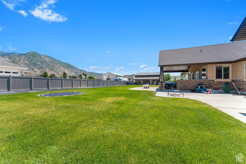 View of yard featuring a patio area and a mountain view