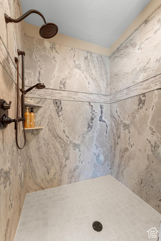 Bathroom featuring tiled shower