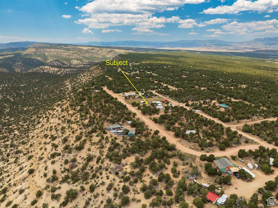 Birds eye view of property featuring a mountain view