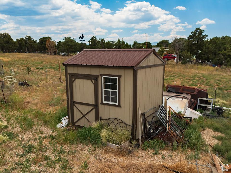 View of outdoor structure with a rural view