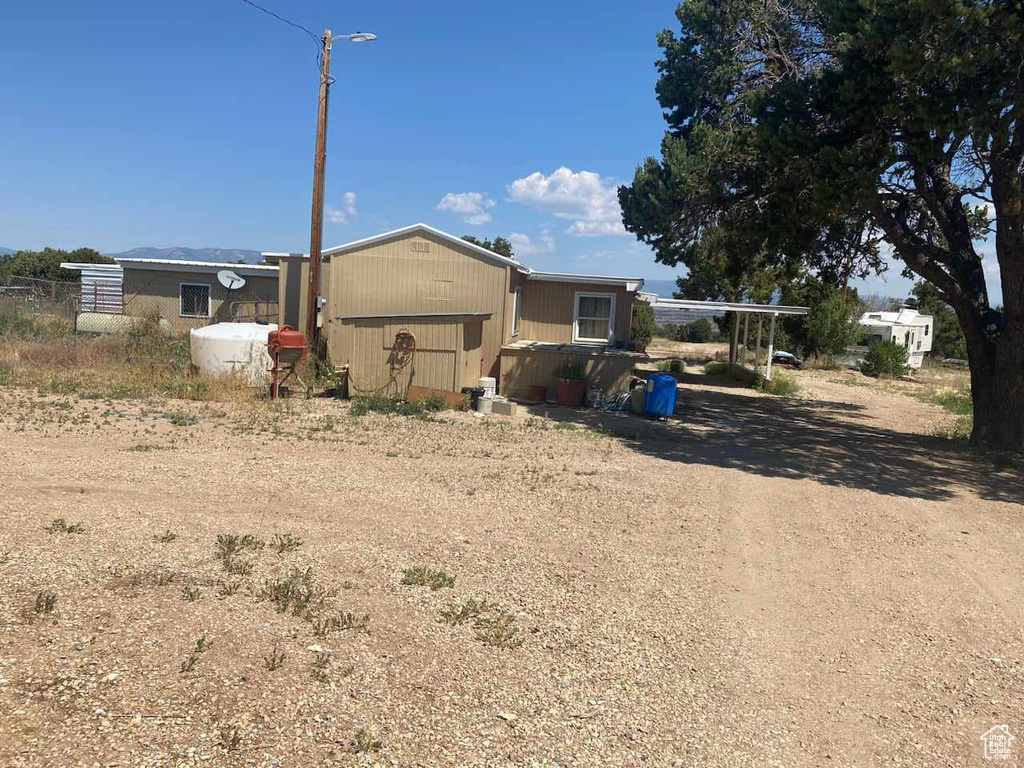 View of front of property with an outdoor structure