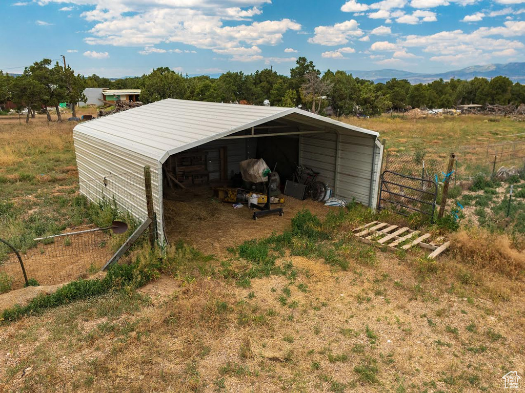 View of outbuilding with a rural view