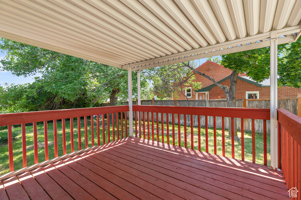 Wooden deck featuring a yard