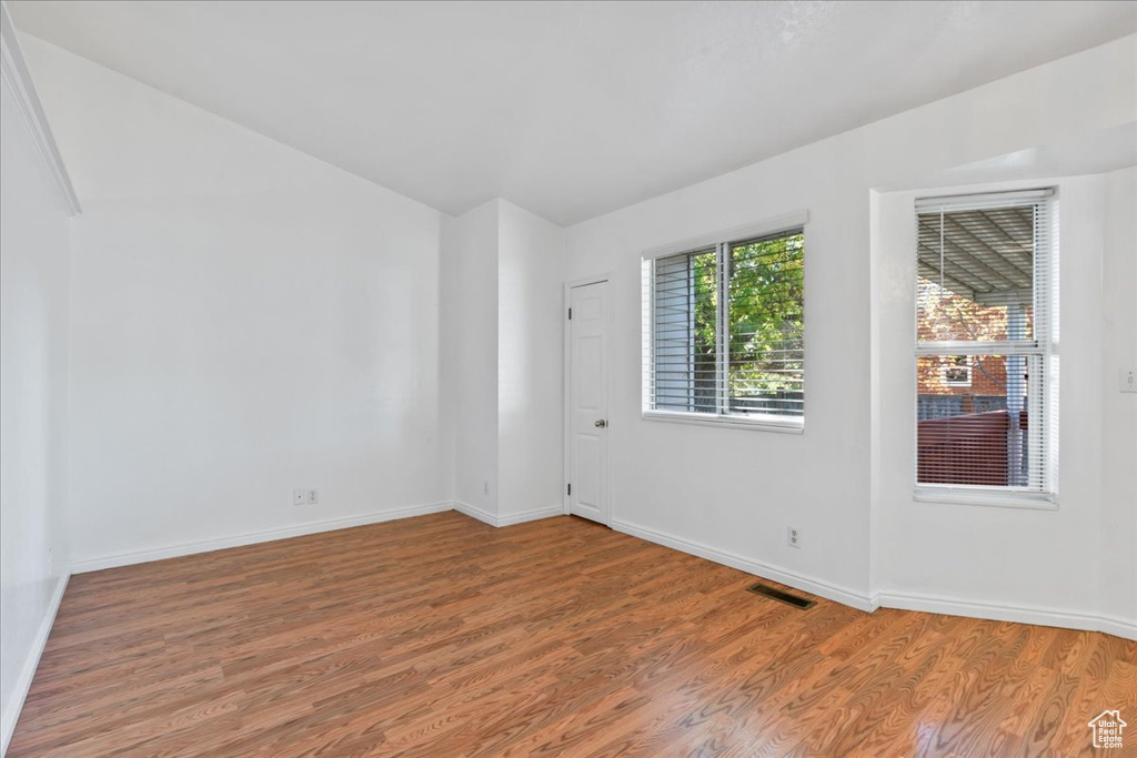 Spare room featuring hardwood / wood-style flooring