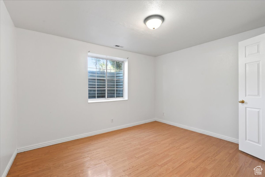 Empty room with light wood-type flooring