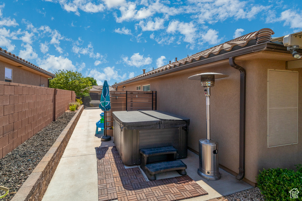 View of patio / terrace featuring a hot tub