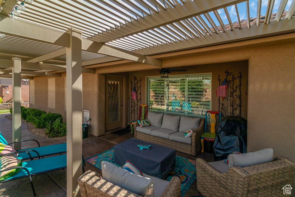 View of patio / terrace with a pergola, outdoor lounge area, and ceiling fan