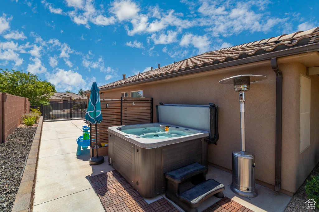 View of patio / terrace with a hot tub