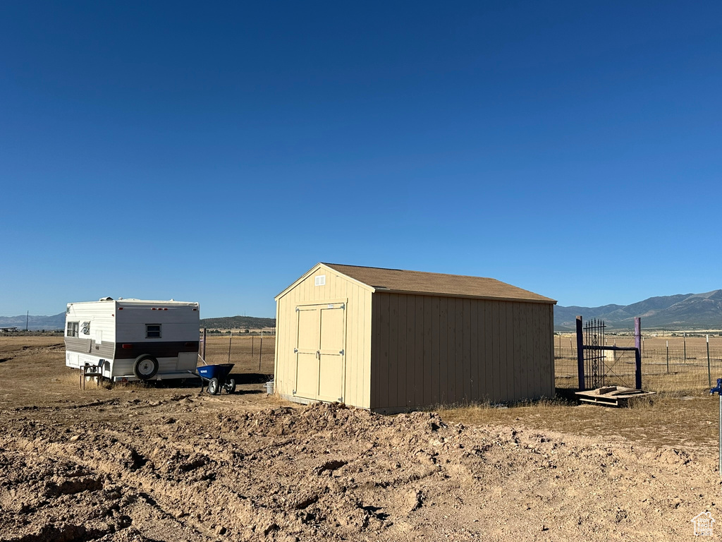 View of outbuilding with a mountain view and a rural view