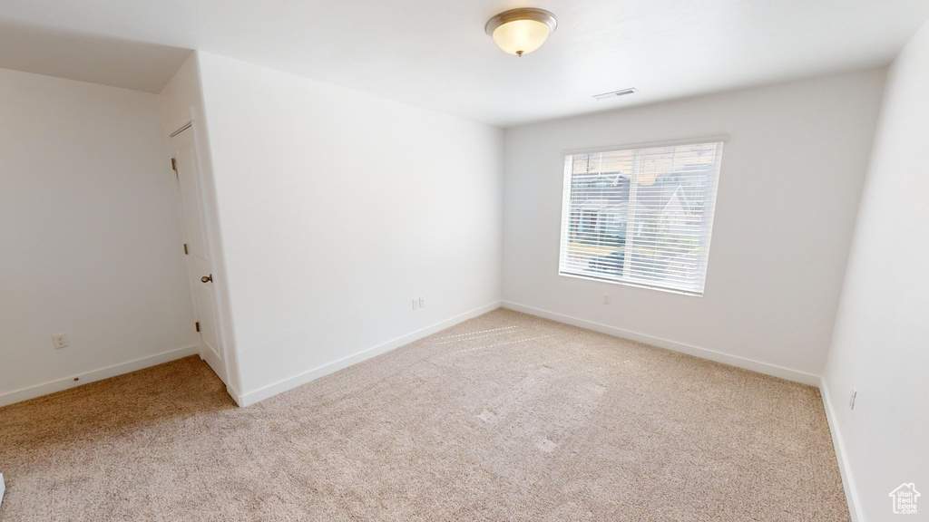 Spare room with light carpet