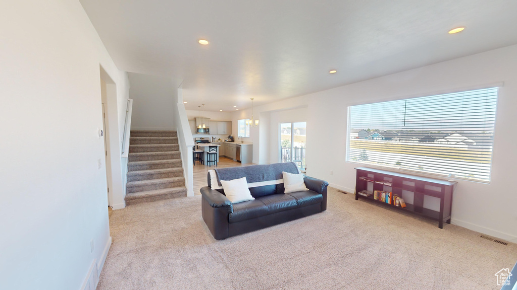 Living room featuring light colored carpet