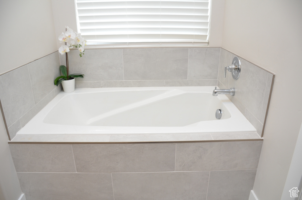 Bathroom featuring tiled tub