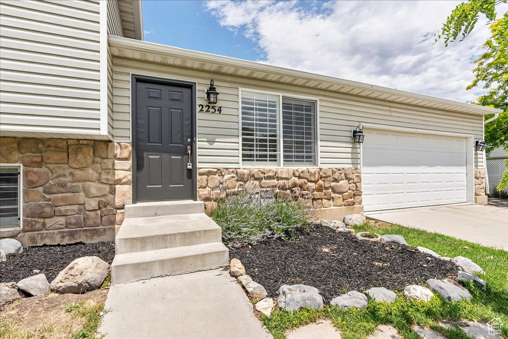 Property entrance with a garage