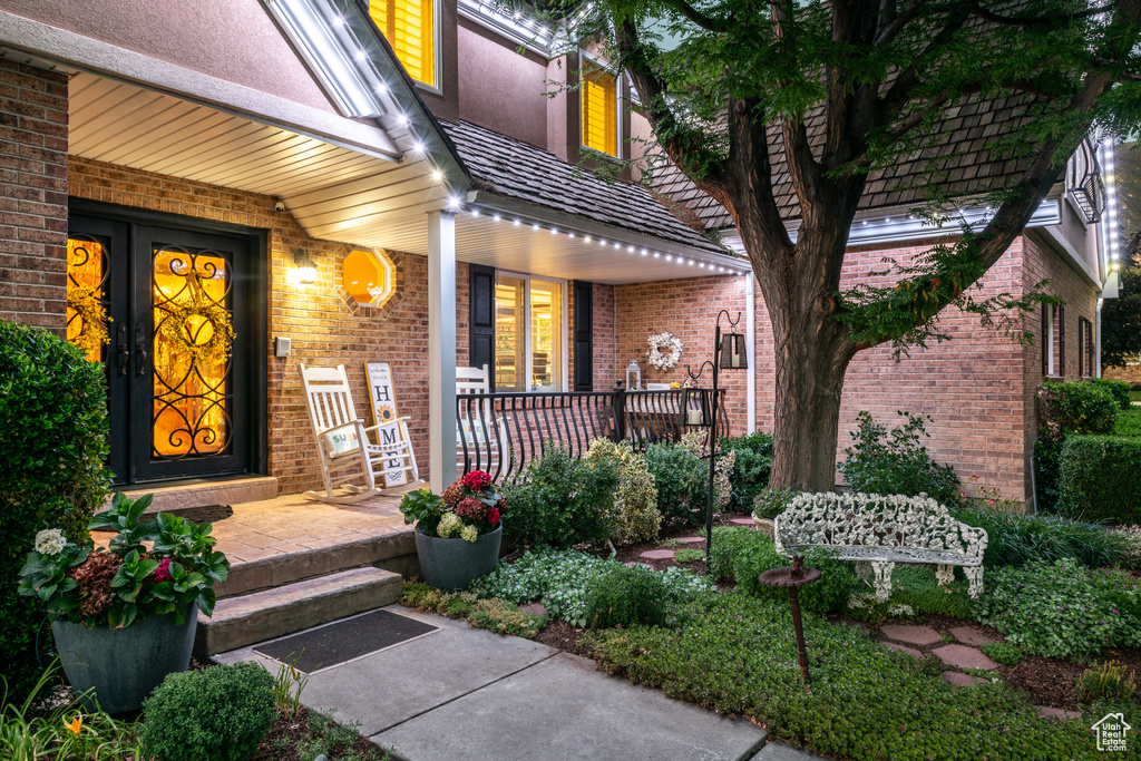 View of exterior entry featuring a porch