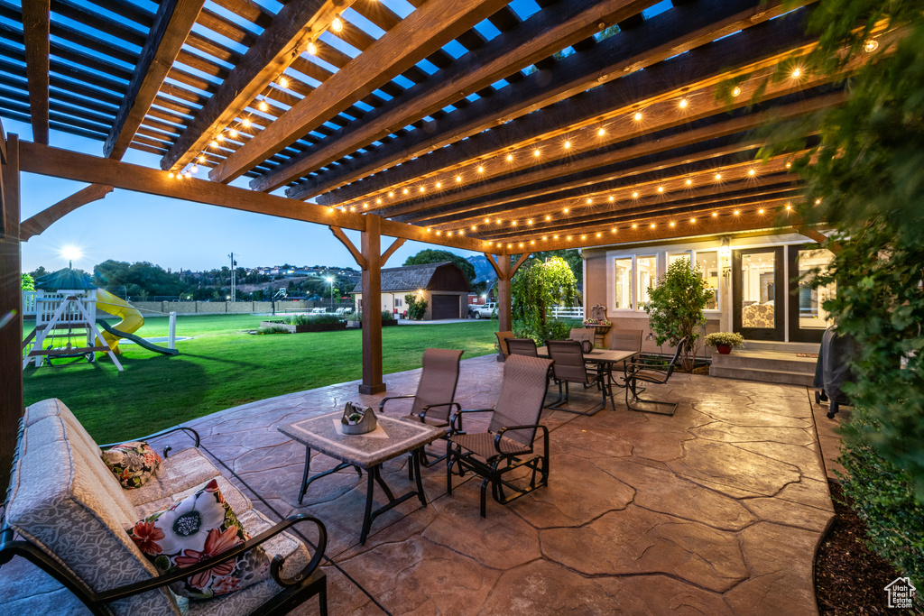 View of patio / terrace with a pergola and a playground