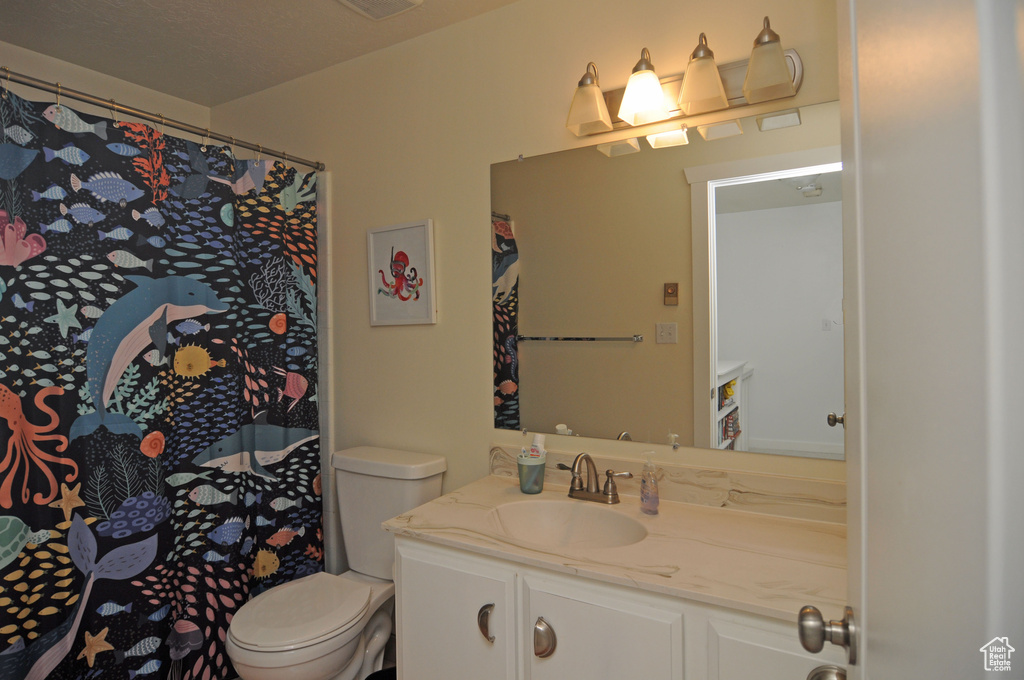 Bathroom with vanity and toilet