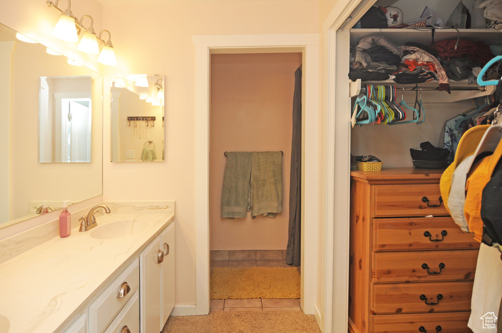 Bathroom with vanity and tile patterned flooring