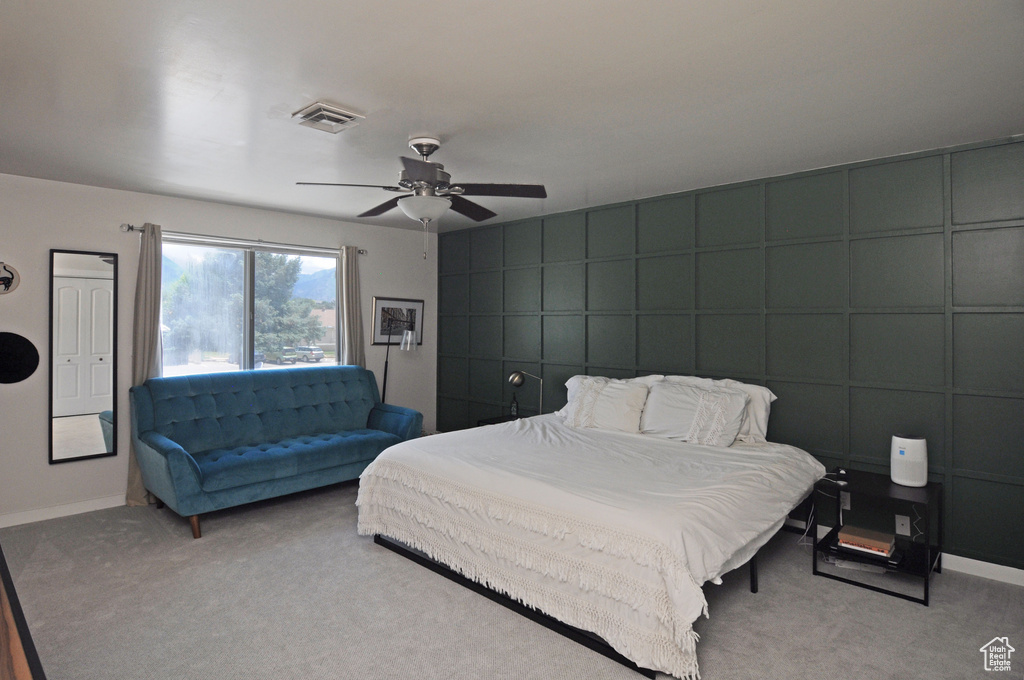 Bedroom featuring carpet and ceiling fan