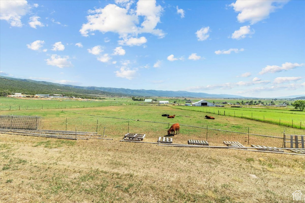 View of yard featuring a mountain view and a rural view