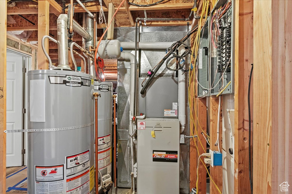 Utility room featuring gas water heater