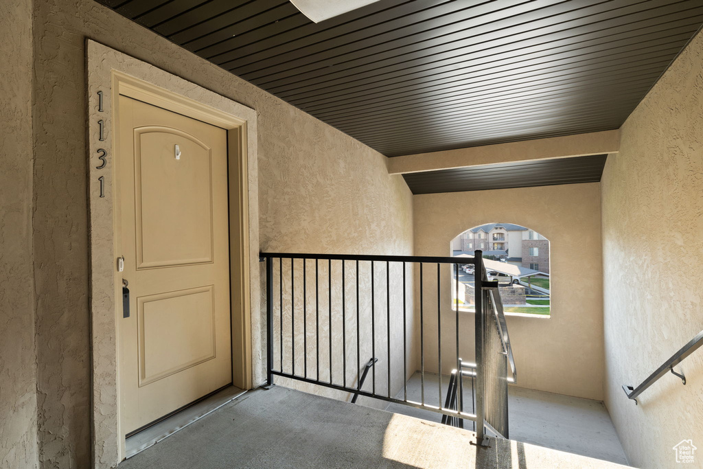 View of exterior entry with a balcony