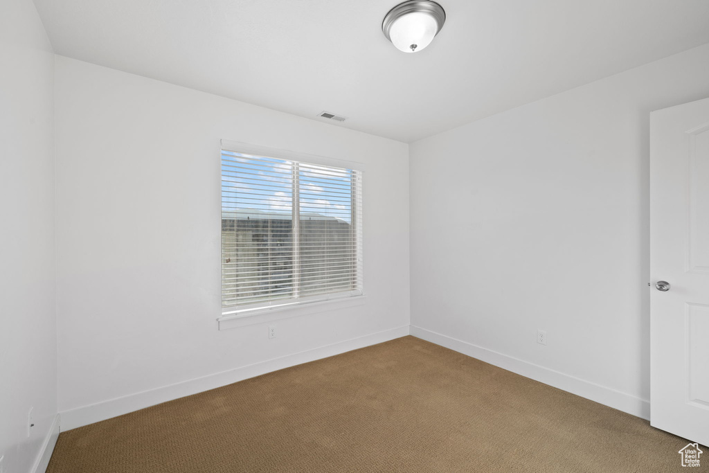 View of carpeted spare room