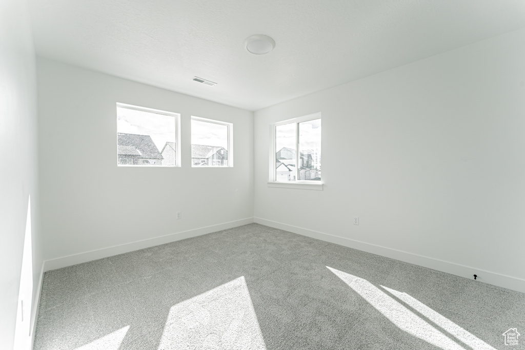 View of carpeted spare room