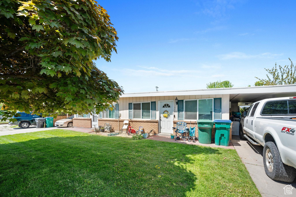 View of front of property with a front lawn