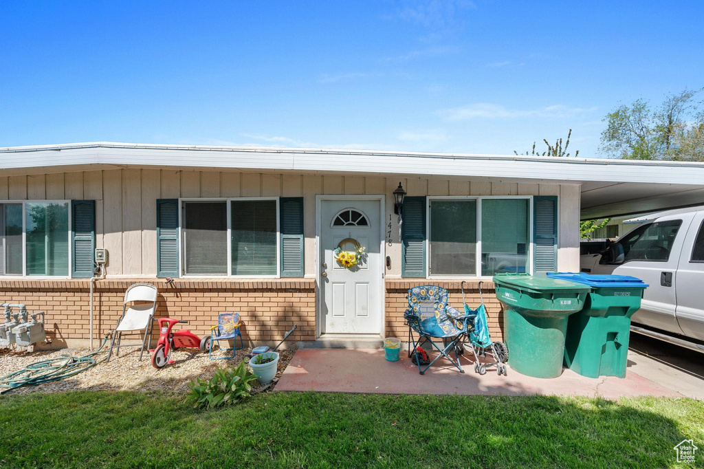 View of front of property featuring a carport