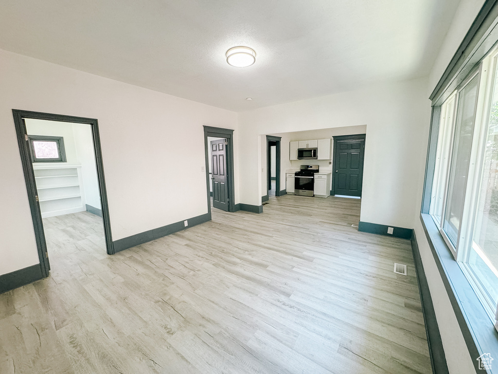 Interior space featuring a healthy amount of sunlight and light hardwood / wood-style floors