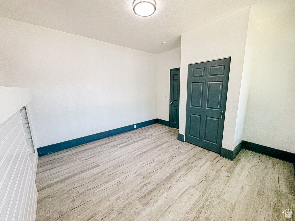 Spare room with light wood-type flooring