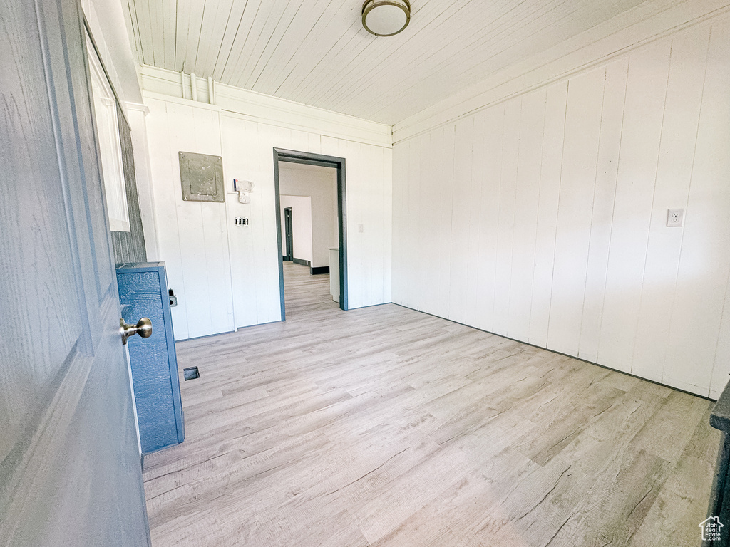 Unfurnished room with light wood-type flooring