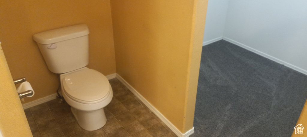 Bathroom featuring tile patterned flooring and toilet